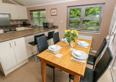 The dining area at 1 Hornbeam Lodge, Camp Hill