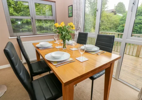 The dining area at 1 Hornbeam Lodge, Camp Hill