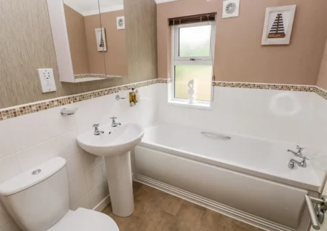 The bathroom at 1 Hornbeam Lodge, Camp Hill