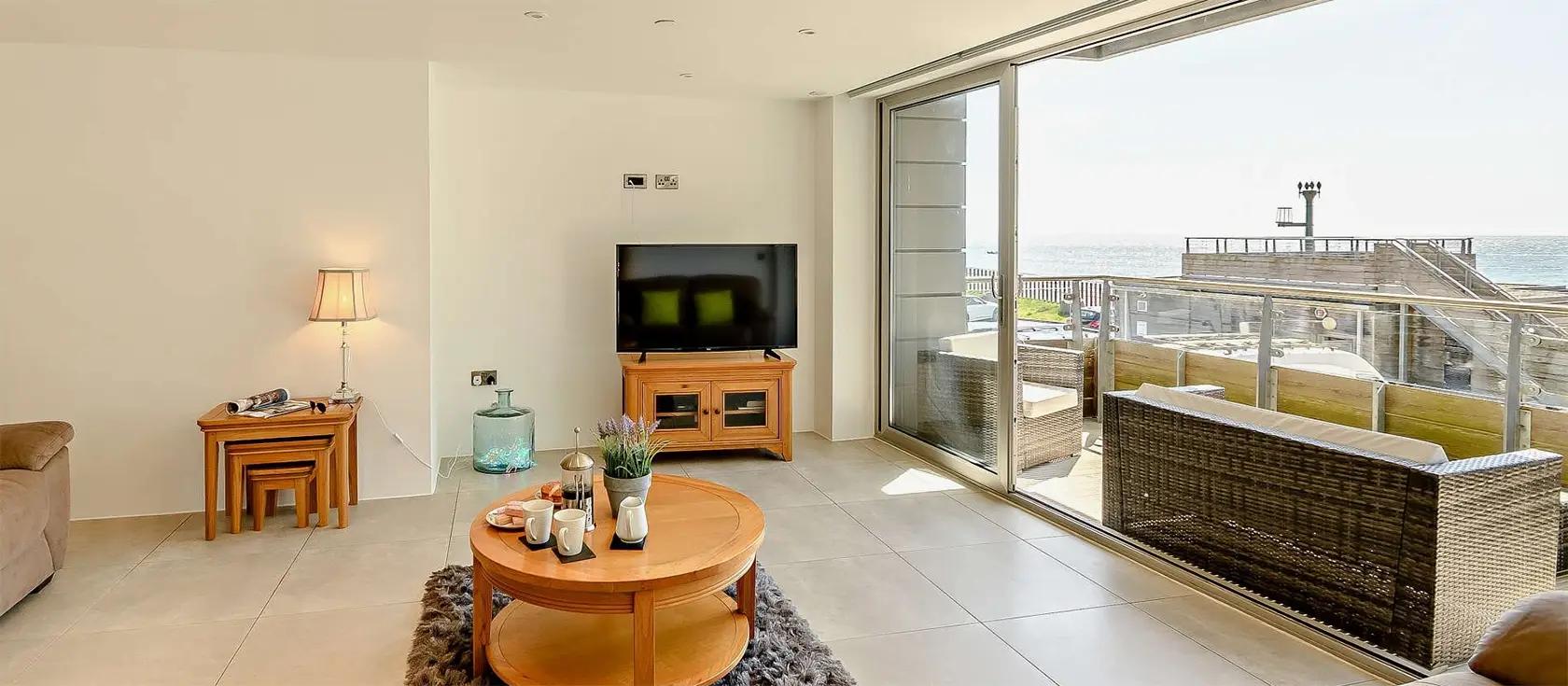 10 Waters Edge, Tenby is a two-bedroom luxurious seaside retreat, perfect for family holidays, offering stunning views, well-designed interiors, and easy access to local attractions, nestled on the Pembrokeshire Coast Path, close to the South Beach.