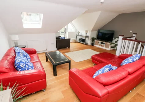 The living area at 22 Giltar House, Tenby