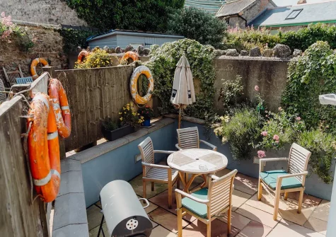 The patio, barbecue & alfresco dining area at Albert View 1, Tenby
