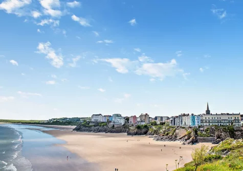 Tenby's North Beach is a long sandy beach set against a backdrop of cliffs on one side and Tenby town & the picturesque harbour on the other