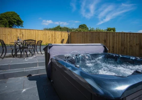 The hot tub, patio & alfresco dining area at Anchor Well, Ludchurch