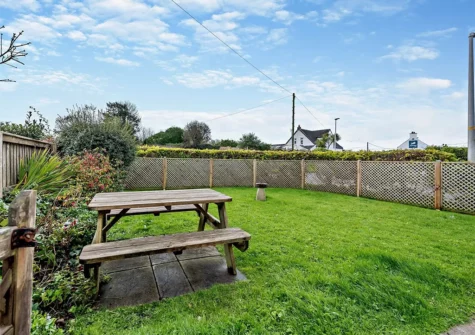 The garden & alfresco dining area at Awel Deg, Jameston