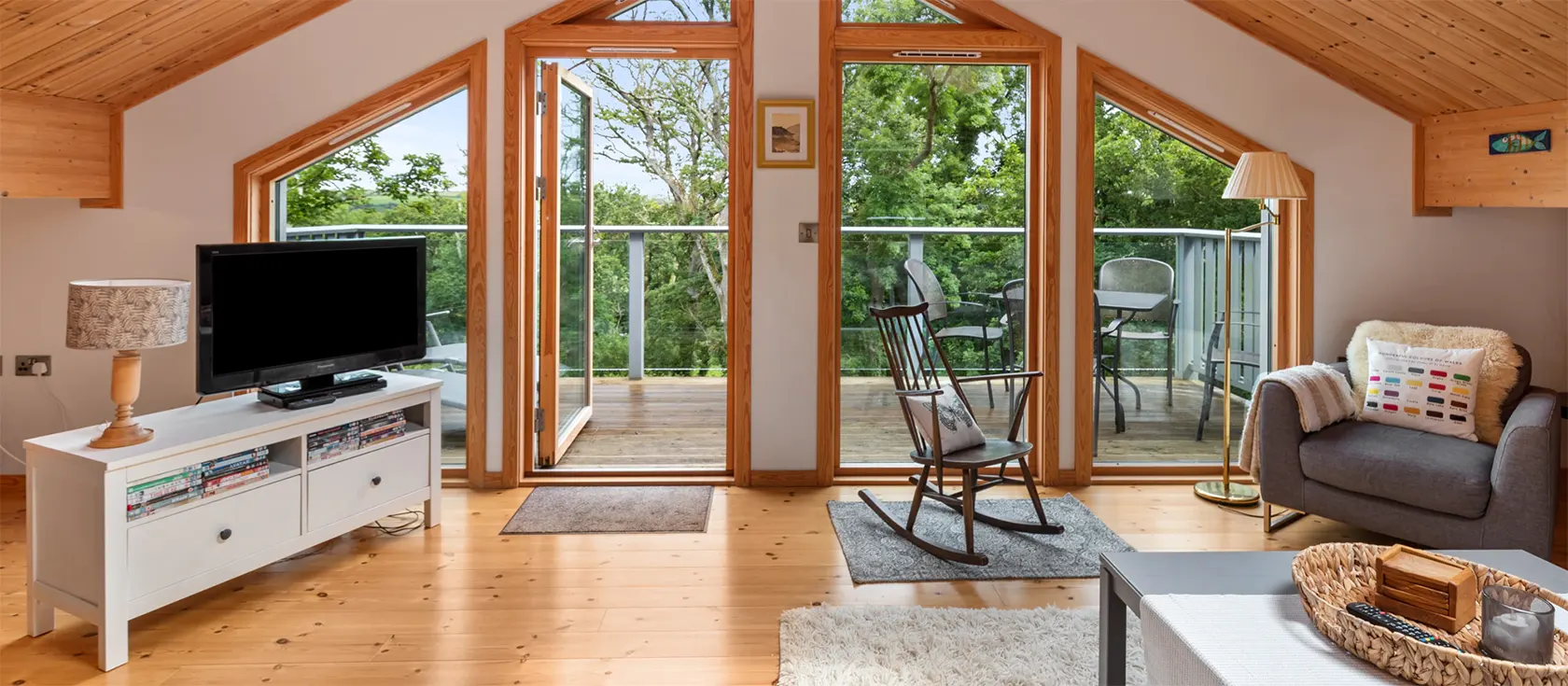 Blue South Wales, Tenby is a beautiful luxury chalet with a fantastic wooden interior, wrap-around porch and incredible views of the Pembrokeshire countryside. It sleeps six in three bedrooms, and guests can access the facilities of Trefloyne Manor.