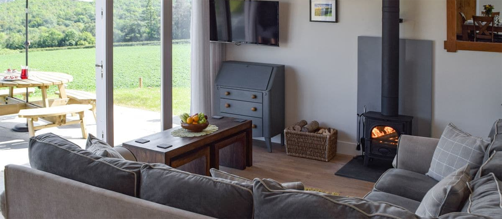 Bwthyn y Bugail, Penrhiw is a beautifully restored three bedroom barn surrounded by stunning countryside near Cenarth Falls. Spacious rooms, logburner & chef's kitchen. Three bedrooms (one ensuite) with vaulted ceilings. Garden & furnished terrace.