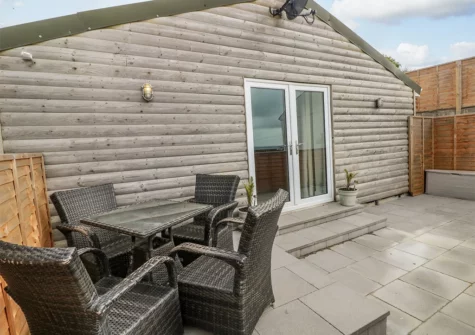 The patio & alfreasco dining area at Caban Y Mor, Amroth