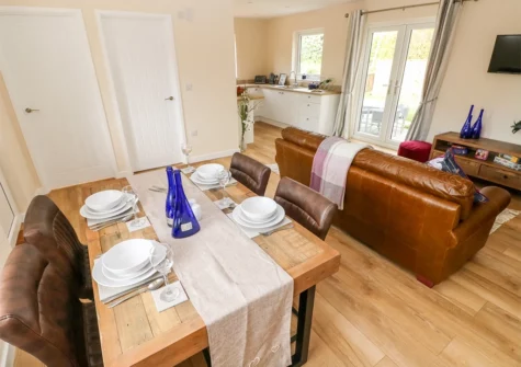 The dining area at Caldey Lodge, Bier Wood Lodges, Manorbier