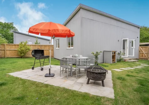 The patio, alfresco dining & barbecue area at Caldey Lodge, Bier Wood Lodges, Manorbier