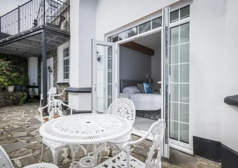 The patio, alfresco dining & barbecue area at Call Of The Crow, Penally