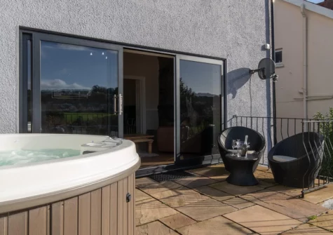 The patio & hot tub at Cartref, Saundersfoot