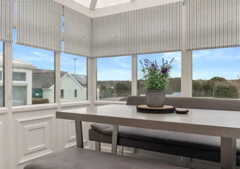 The conservatory dining room at Cartwright's Cottage, St Florence