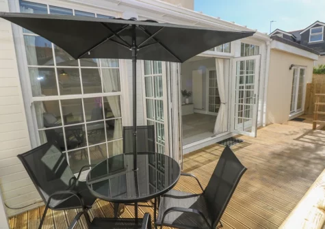 The decked patio & alfresco dining area at Castle at The Hideaway, Tenby