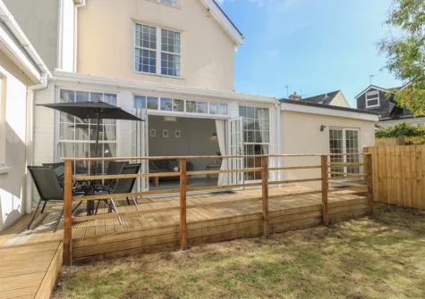 The decked patio & alfresco dining area at Castle at The Hideaway, Tenby