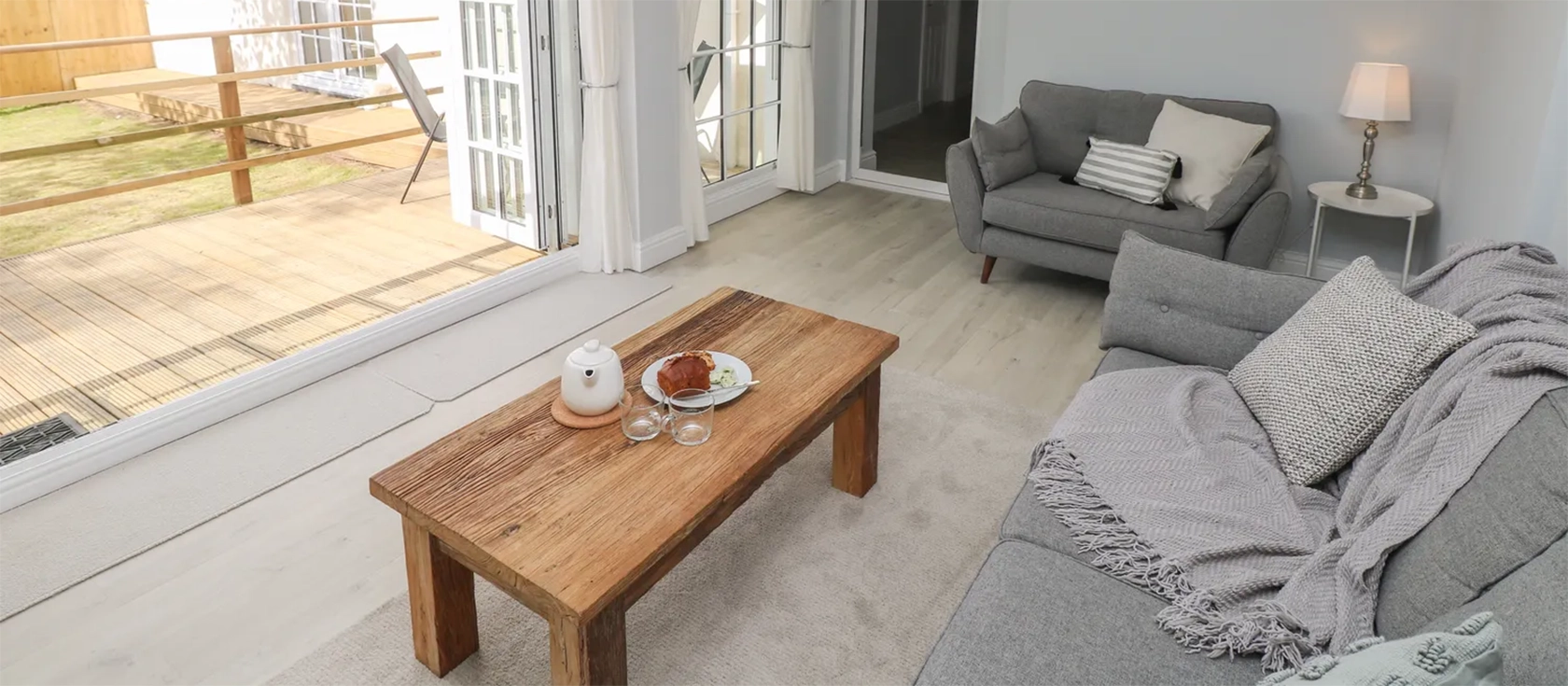 Castle at The Hideaway, Tenby is a spacious ground-floor apartment in the heart of Tenby. It features a well-equipped kitchen/diner, a cosy sitting room, two bedrooms with en-suites, and an enclosed garden with decking and seating.
