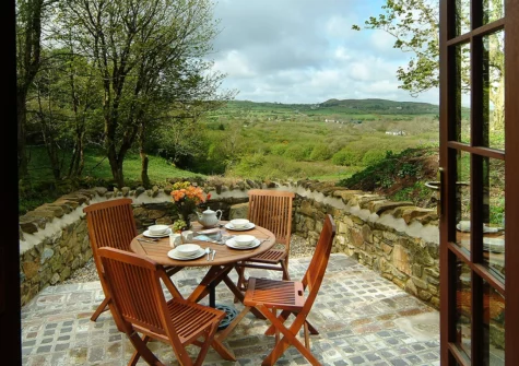 The patio & alfresco dining area at Cwm Bach, Dinas