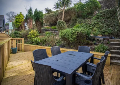 The decked patio & alfresco dining area at Daisy Cottage, Tenby