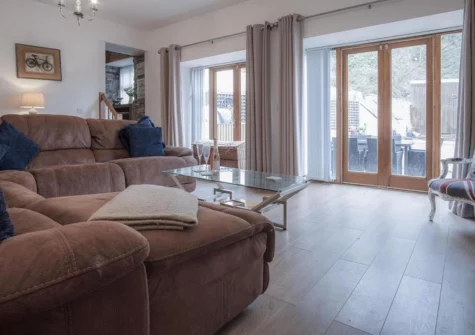 The living area at Fletcher Coach House, Llanmiloe