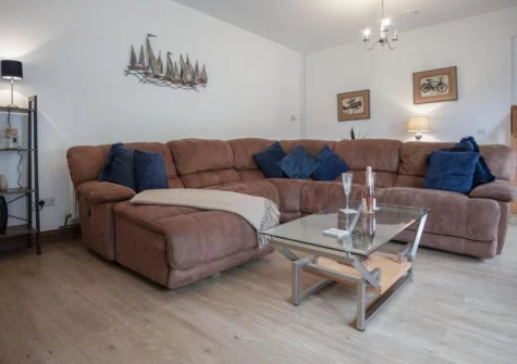 The living area at Fletcher Coach House, Llanmiloe