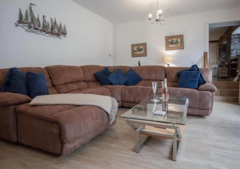The living area at Fletcher Coach House, Llanmiloe