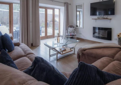 The living area at Fletcher Coach House, Llanmiloe