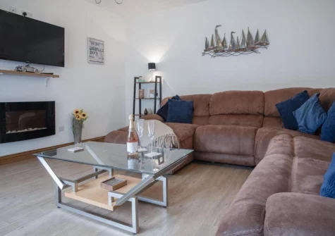 The living area at Fletcher Coach House, Llanmiloe