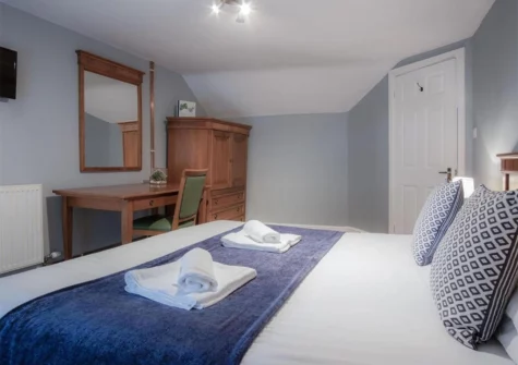 The bedroom #1 at Fletcher Coach House, Llanmiloe