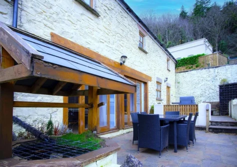 The patio & alfresco dining area at Fletcher Coach House, Llanmiloe