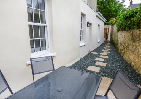 The enclosed courtyard & alfresco dining area at Harbour Beach at The Hideaway, Tenby