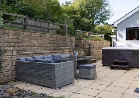 The patio, alfresco dining area & hot tub at Hazelglade Cottage, Saundersfoot