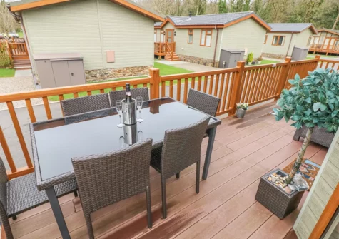 The decked patio & alfresco dining at Heddwch, Heritage Park, Stepaside