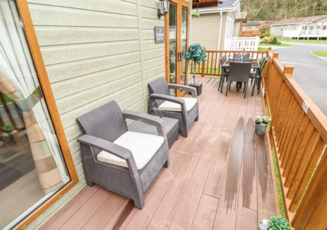 The decked patio & alfresco dining at Heddwch, Heritage Park, Stepaside