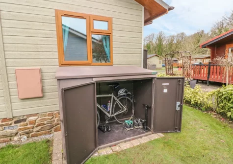 The bike storage & garden at Heddwch, Heritage Park, Stepaside