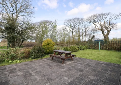 The patio & alfresco dining area at Hill Top Farm Cottage, Cross Hands