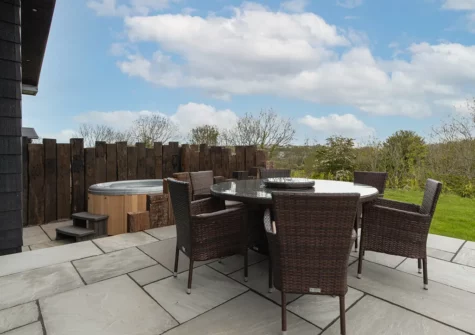 The terrace, alfresco dining area & hot tub at Land Of My Fathers, Penally Grange, Penally