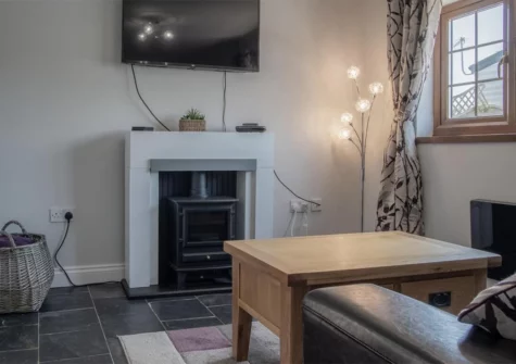 Lilac Cottage, Amroth is a cosy, romantic cottage for two, with a hot tub for guests and park views, perfect for a couple's retreat. Set within Amroth Bay Holiday park, this cottage has a lovely patio out the front and back with outside seating.