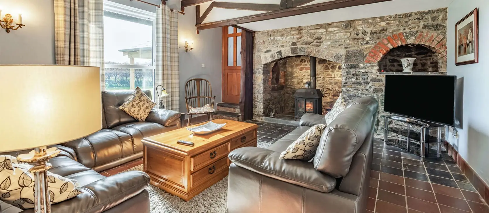 Lower Nash Farmhouse, Lower Nash is a spacious six-bedroom family retreat with a large garden, modern comforts, and close to historic sites. Nestled along a quiet country lane near Cosheston village, it's close to a charming pub and a tidal river.