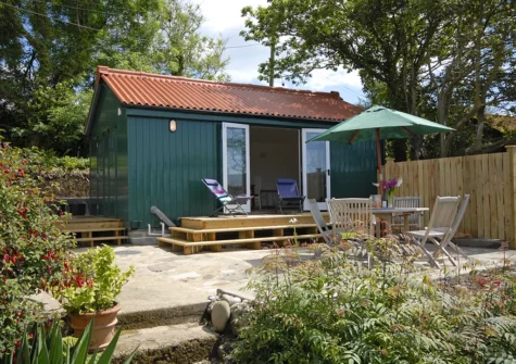 The outdoor garden room & patio at Monkstone View, Saundersfoot