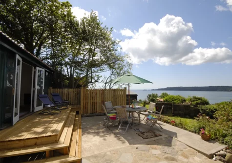 The outdoor garden room & patio at Monkstone View, Saundersfoot