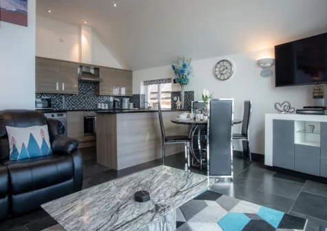 The open plan living, dining area & kitchen at Nautilus, Pendine
