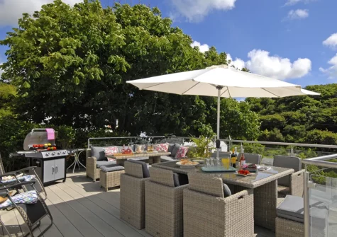 The patio, barbecue & alfresco dining area at Oswald House, Little Haven