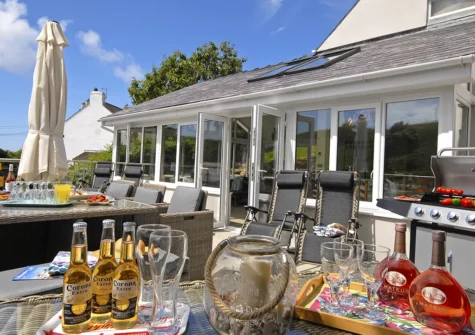 The patio, barbecue & alfresco dining area at Oswald House, Little Haven