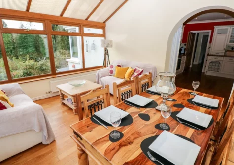 The conservatory dining area at Pen Y Daith, Stepaside