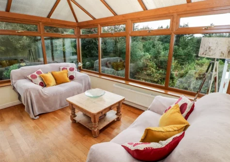 The conservatory dining area at Pen Y Daith, Stepaside