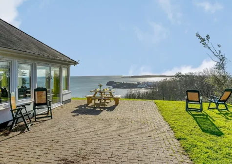 The patio, alfresco dining area & garden at Pine View, Tenby