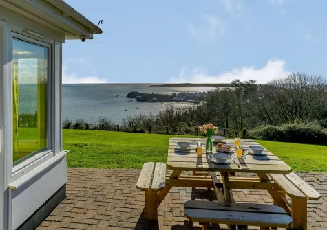 The patio, alfresco dining area & garden at Pine View, Tenby