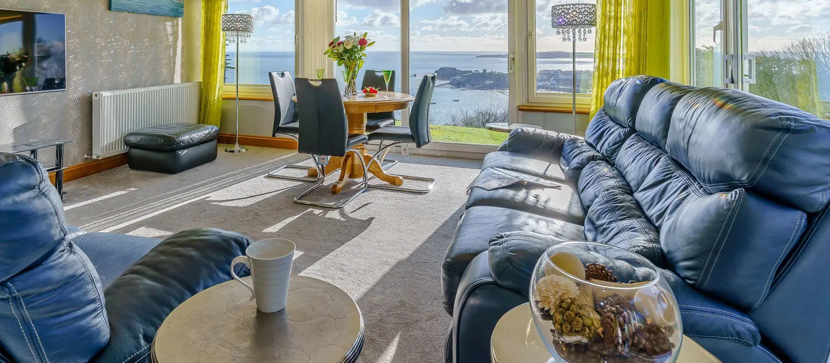 Pine View, Tenby is a luxurious ground-floor apartment offering panoramic bay views in a secluded coastal setting. With two large bedrooms, modern amenities, and a patio garden, it's perfect for couples & families seeking a tranquil seaside break.