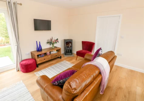 The living area at Ramsey Lodge, Bier Wood Lodges, Manorbier