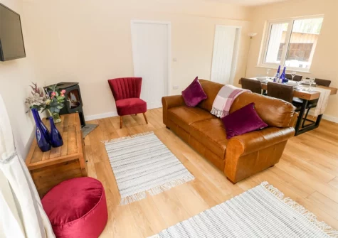 The living area at Ramsey Lodge, Bier Wood Lodges, Manorbier